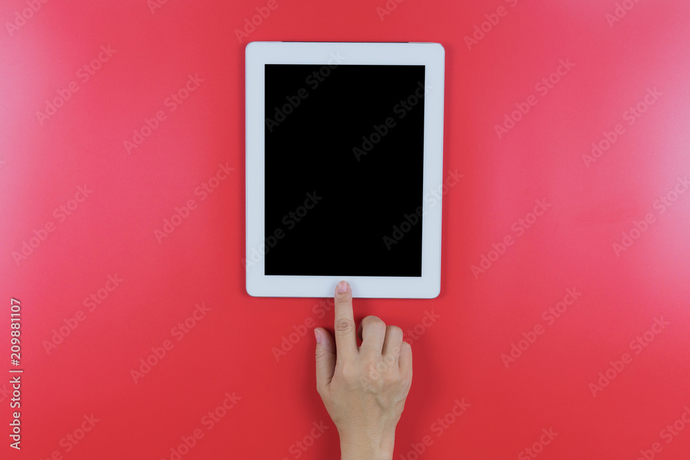 hand on tablet on red background, hand on tablet on red background,