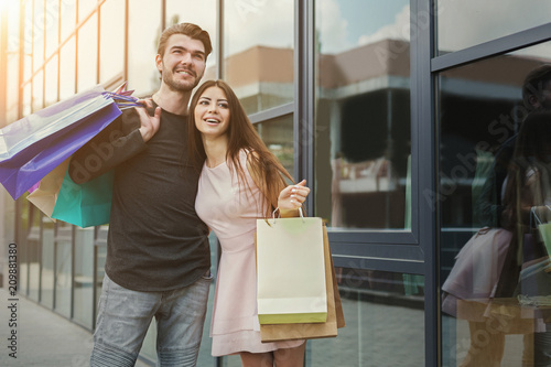 Happy couplr shopping in the city photo
