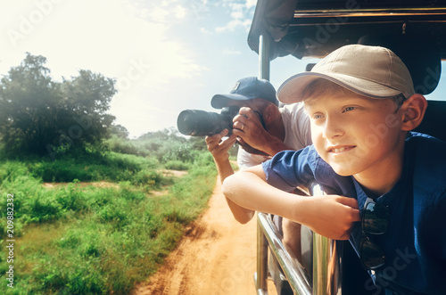 Photography Little expiorer boy with his father on jeep safari