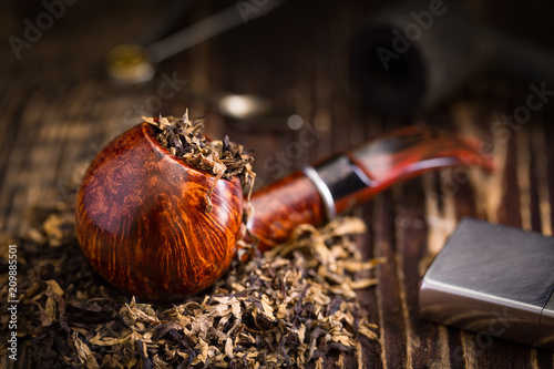 smoking pipe with tobacco leaves