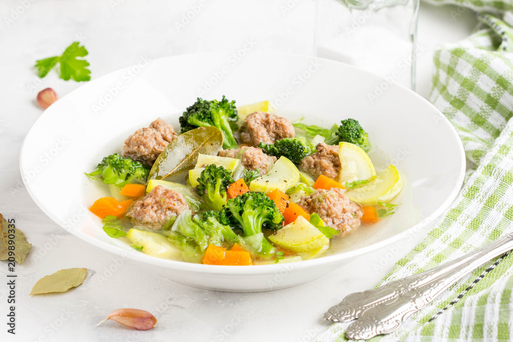 Vegetable soup with beef meatballs, carrots, cabbage, zucchini, broccoli, healthy homemade lunch Vegetable soup with beef meatballs, carrots, cabbage, zucchini, broccoli, healthy homemade lunch