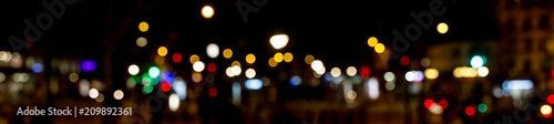 Bokeh traffic light at night in the street of a big city