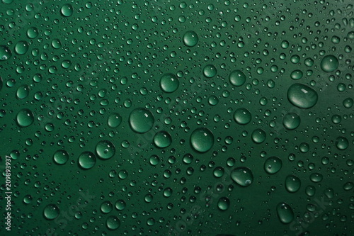 water drops on green background texture