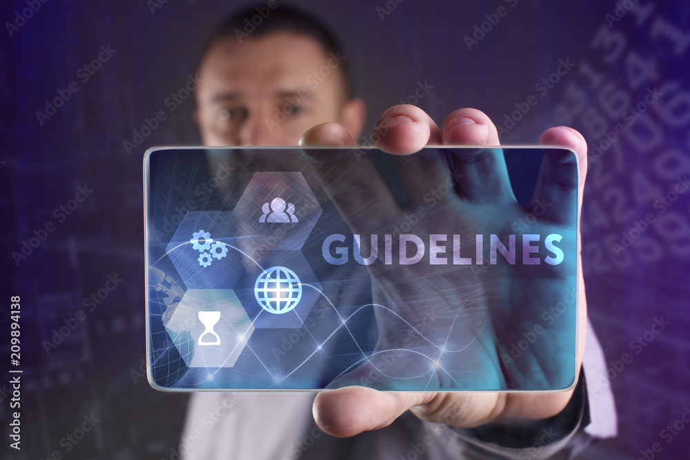 Fototapeta premium The concept of business, technology, the Internet and the network. A young entrepreneur working on a virtual screen of the future and sees the inscription: Guidelines