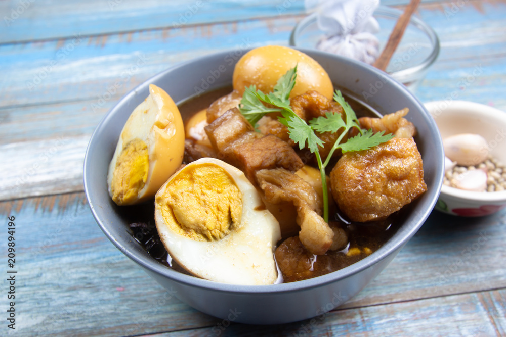 sweet brown Stewed pork gravy in bowl sweet brown Stewed pork gravy in bowl
