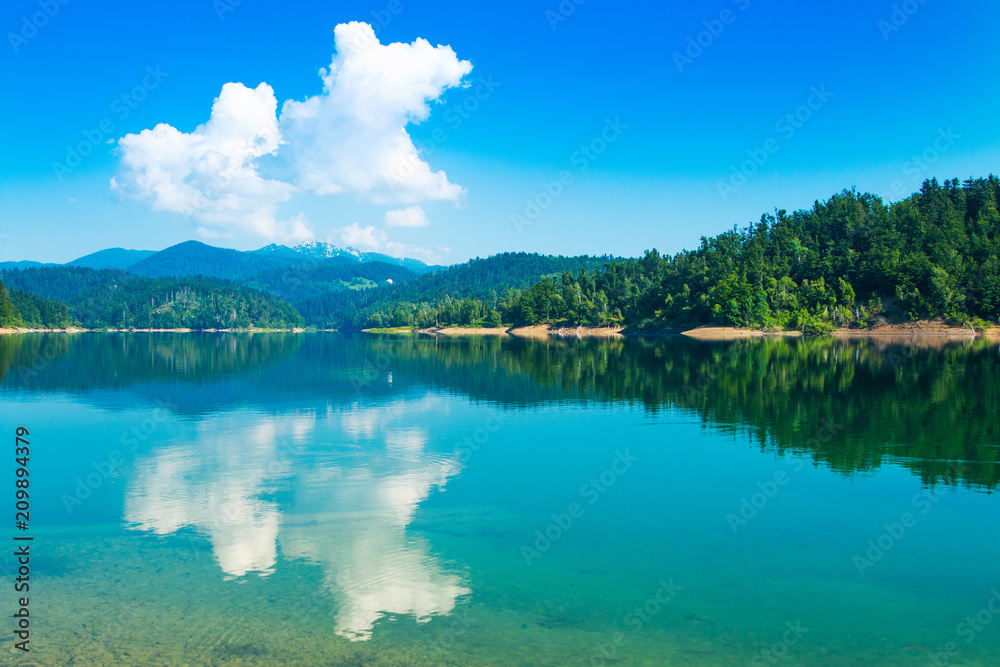 Spectacular mountain landscape, region Gorski kotar, Croatia, Lokvarsko lake with Risnjak mountain in background, reflection in watter 