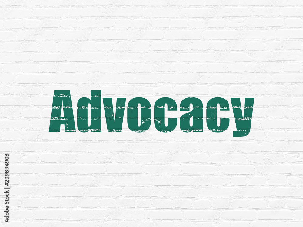Law concept: Painted green text Advocacy on White Brick wall background
