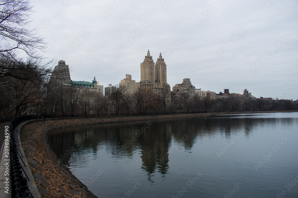 A view of the lake and buildings in Central Park, New York City
