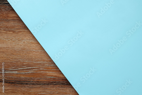 Light blue pastel paper color on wooden table for background