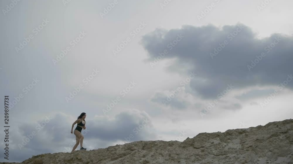 Sports brunette is training in the distance Sports brunette is training in the distance