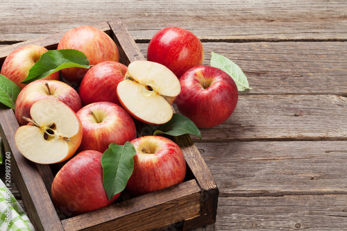 Red apples in wooden box