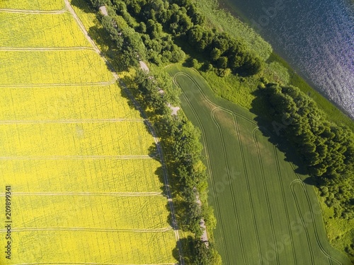 Aerial view of rural landscape of lake district - Mazury, Poland. Mamry Lake on the right photo