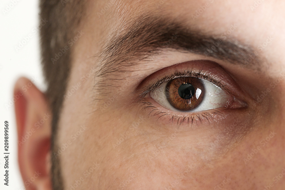 Close up view of a brown man eye looking at camera - obrazy, fototapety, plakaty 