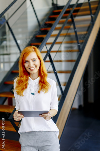 Pretty young red hair woman...
