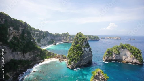 Aerial view of the small island of Nusa Batumategan and Nusa Batupadasan Island from the Atuh Rija Lima shrine on Nusa Penida Island near Bali, Indonesia. photo