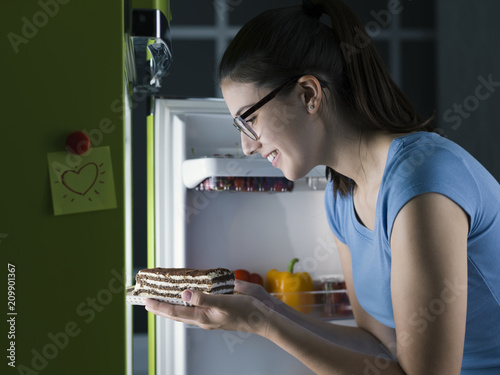 Woman having a late night snack photo