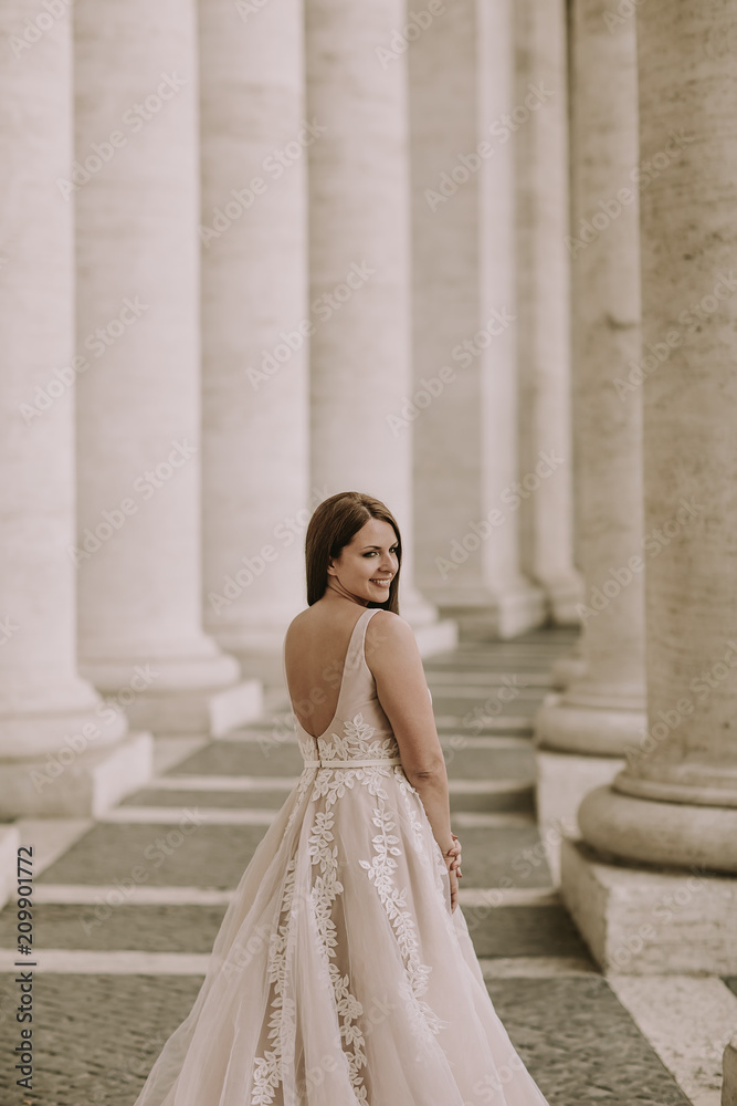 Fototapeta premium Pretty young bride in wedding dress in the Vatican