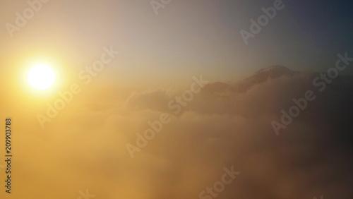 cloudy sunrise view over Mount Batur during sunrise tour, Bali, Indonesia