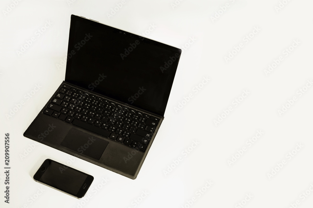 laptop and mobile phone on white background