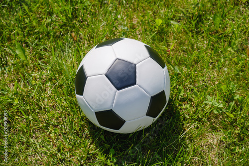 Traditional soccer ball on soccer field