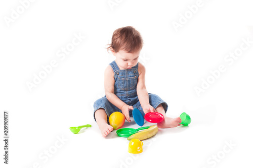 adorable baby playing with colorful toys