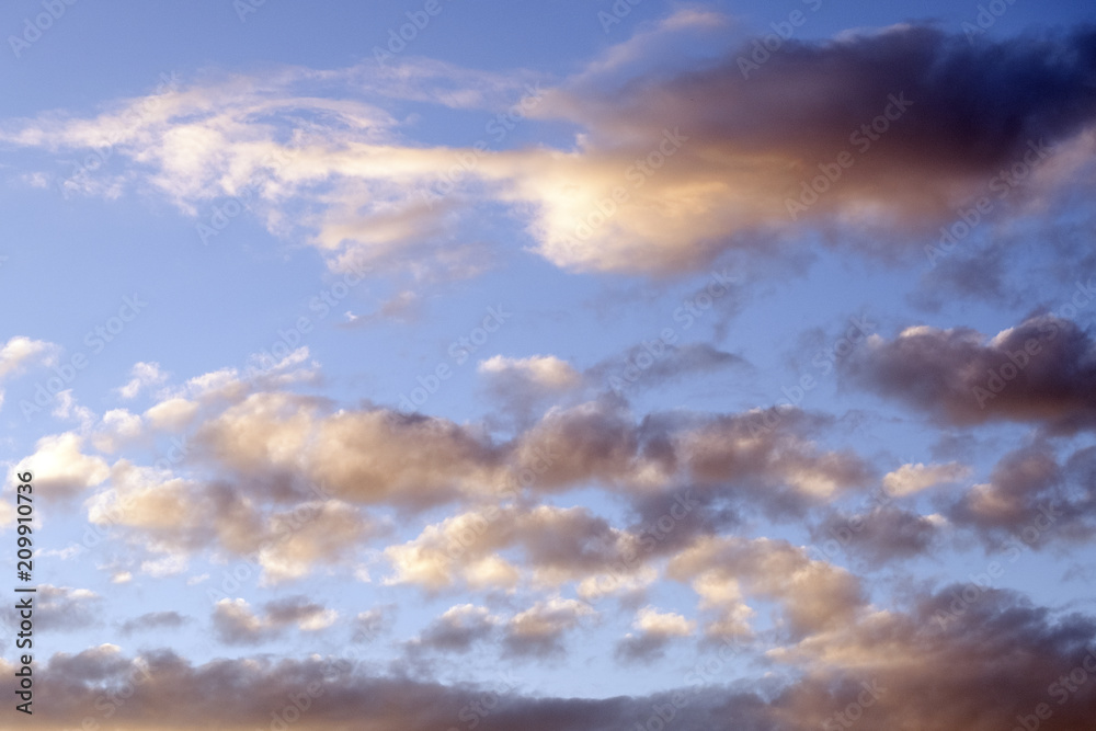Background for the designer. Beautiful sunset blue sky with clouds.