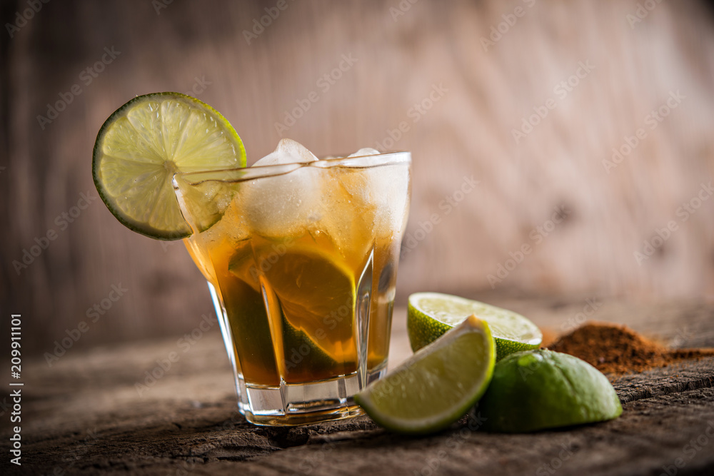 Lime cinnamon refreshing drink with ice cubes Lime cinnamon refreshing drink with ice cubes
