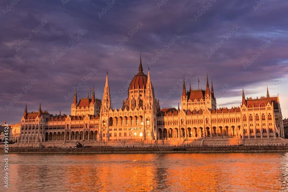 Hungarian parliament building in Budapest at sunset, view from the Danube river
