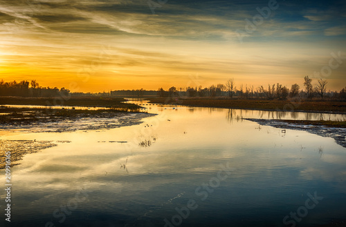 Colorful sunset in a flooded polder landscape