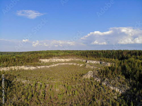 Aerial photographs. Abandoned quarry. The mountains in the woods.
