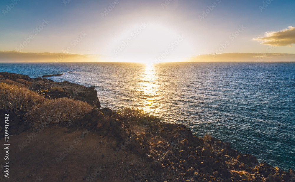 Fototapeta premium Landscape showing in the sky the colors of a sunset. In the ocean of the Canary Islands, Tenerife