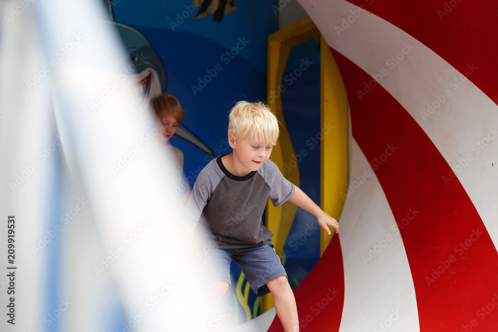 Little Children Playing in Funhouse Spinning Tunnel at Carnival Funhouse Stock Photo Adobe Stock