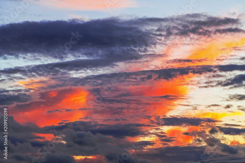 Layered forms of beautiful clouds with red sunset. © Sivenkov