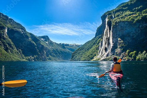 Canvas Print man kayaking along the fjord