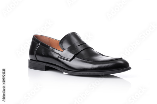 Close up of a black men penny loafers shoes on white background with reflection. Fashion advertising shoes photos.