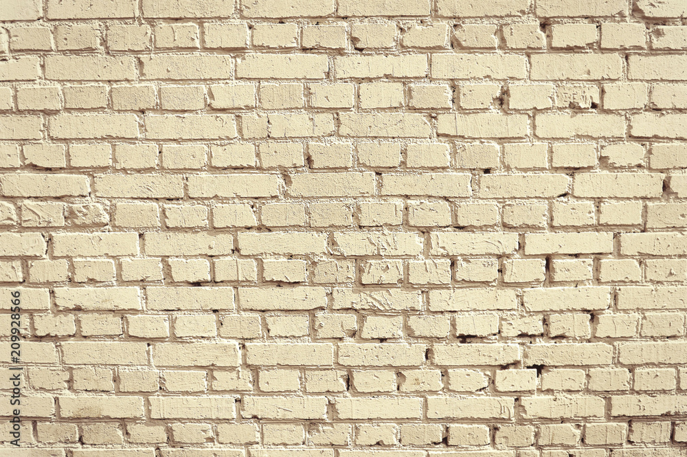 Fototapeta premium Old beige brick wall background