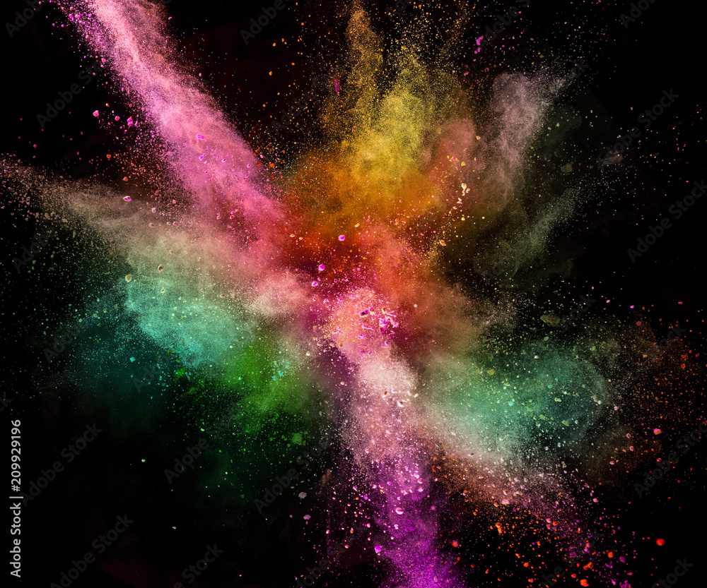 Colored powder explosion isolated on black background.