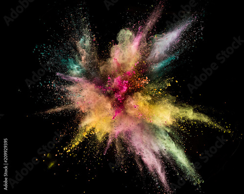 Colored powder explosion isolated on black background. © Lukas Gojda