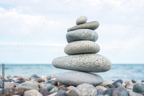 Stack of stones on the sea beach, stone balance