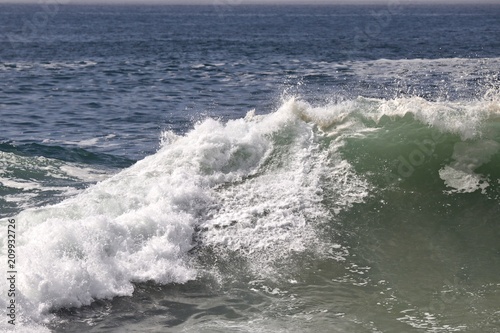 Large powerful wave crashing in the ocean 