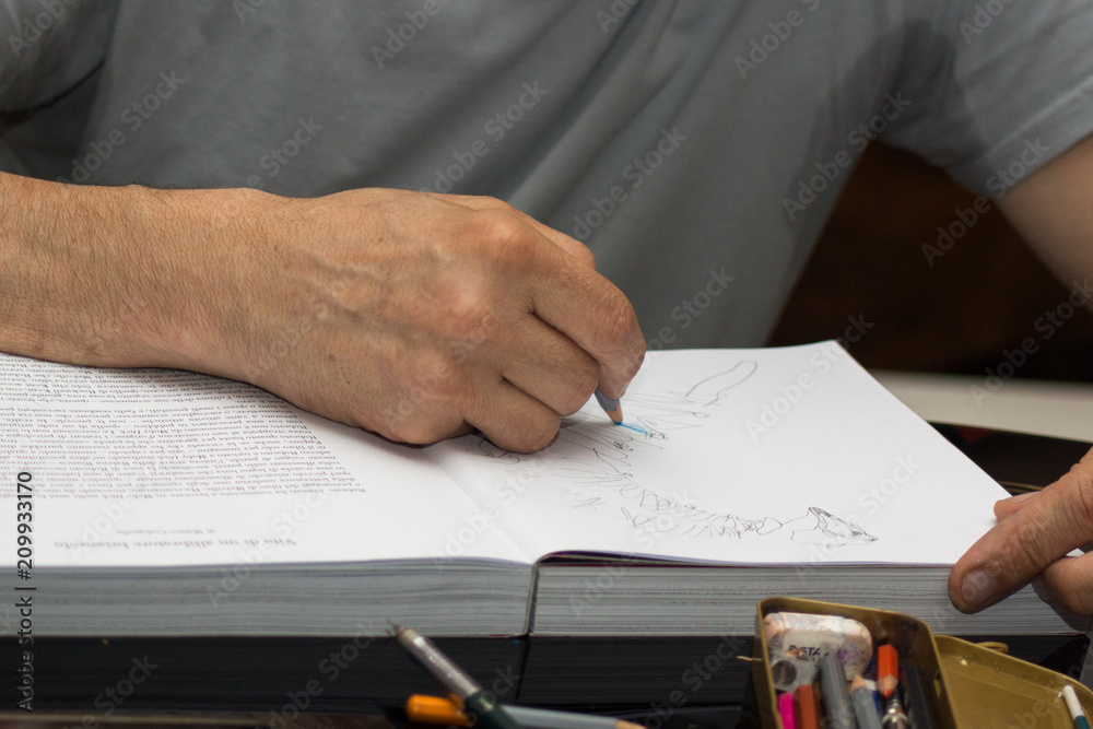 artista che autografa il libro artista che autografa il libro