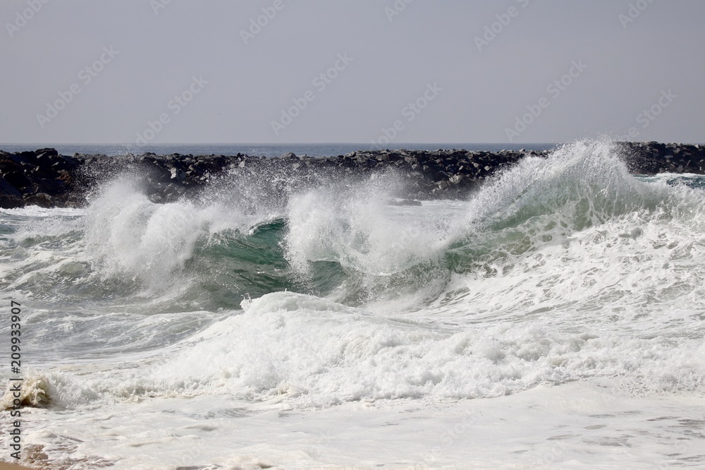 Large powerful wave crash at The Wedge in Newport Beach during a south swell Large powerful wave crash at The Wedge in Newport Beach during a south swell