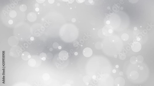Beautiful silver colored blurry circle bokeh motion background. Christmas and New Year copy space decoration animation.  photo
