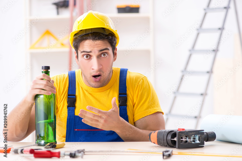 Drunk engineer working in the workshop Drunk engineer working in the workshop
