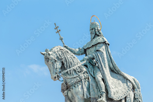 Equestrian statue of Saint Stephen or Istvan near the Fishermans Bastion at the Buda castle in Budapest photo