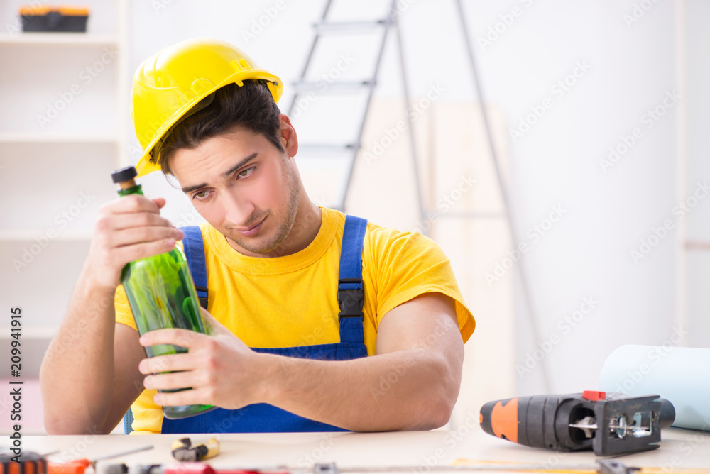 Drunk engineer working in the workshop Drunk engineer working in the workshop