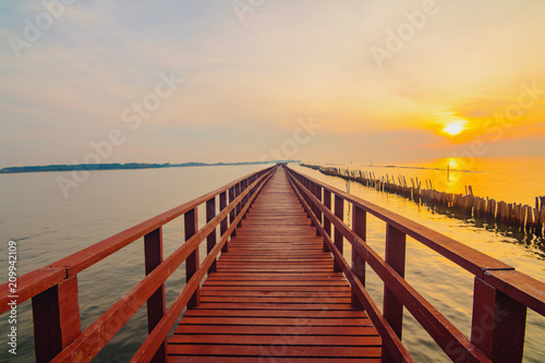 In the morning The red bridge and sun up on horizon.  bridge cross sea in Thailand .Thailand landscape .
