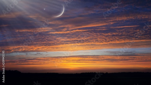 Crescent moon with Stars . Crescent moon with beautiful sunset background . Generous Ramadan .  new moon . 
