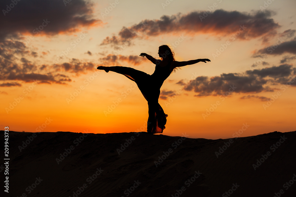 Silhouette of a dancer at sunset.