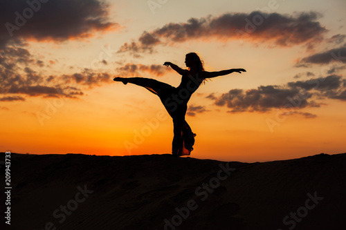 Silhouette of a dancer at sunset.
